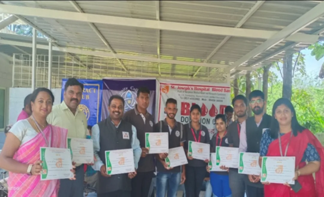 Rotaract volunteers with certificates after the blood donation camp