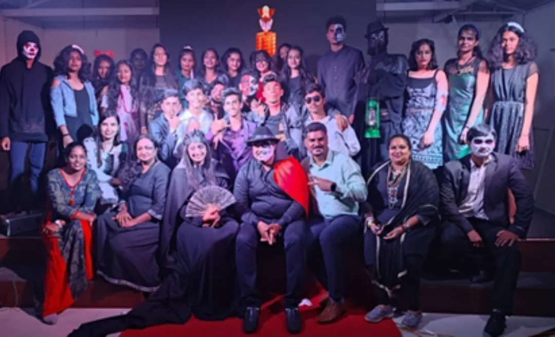 Trinity students on stage in costume for Halloween