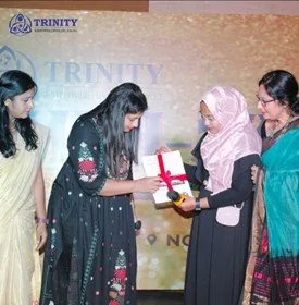 A student being presented a gift on stage