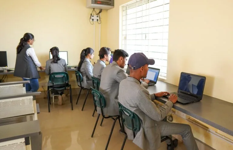 BCA students working in the computer lab at Trinity College Mysore